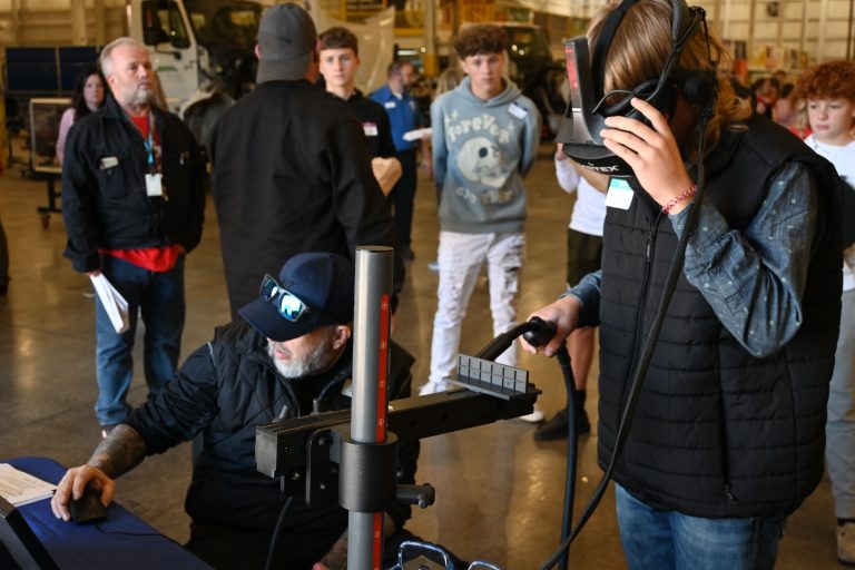 students listen as professional talks