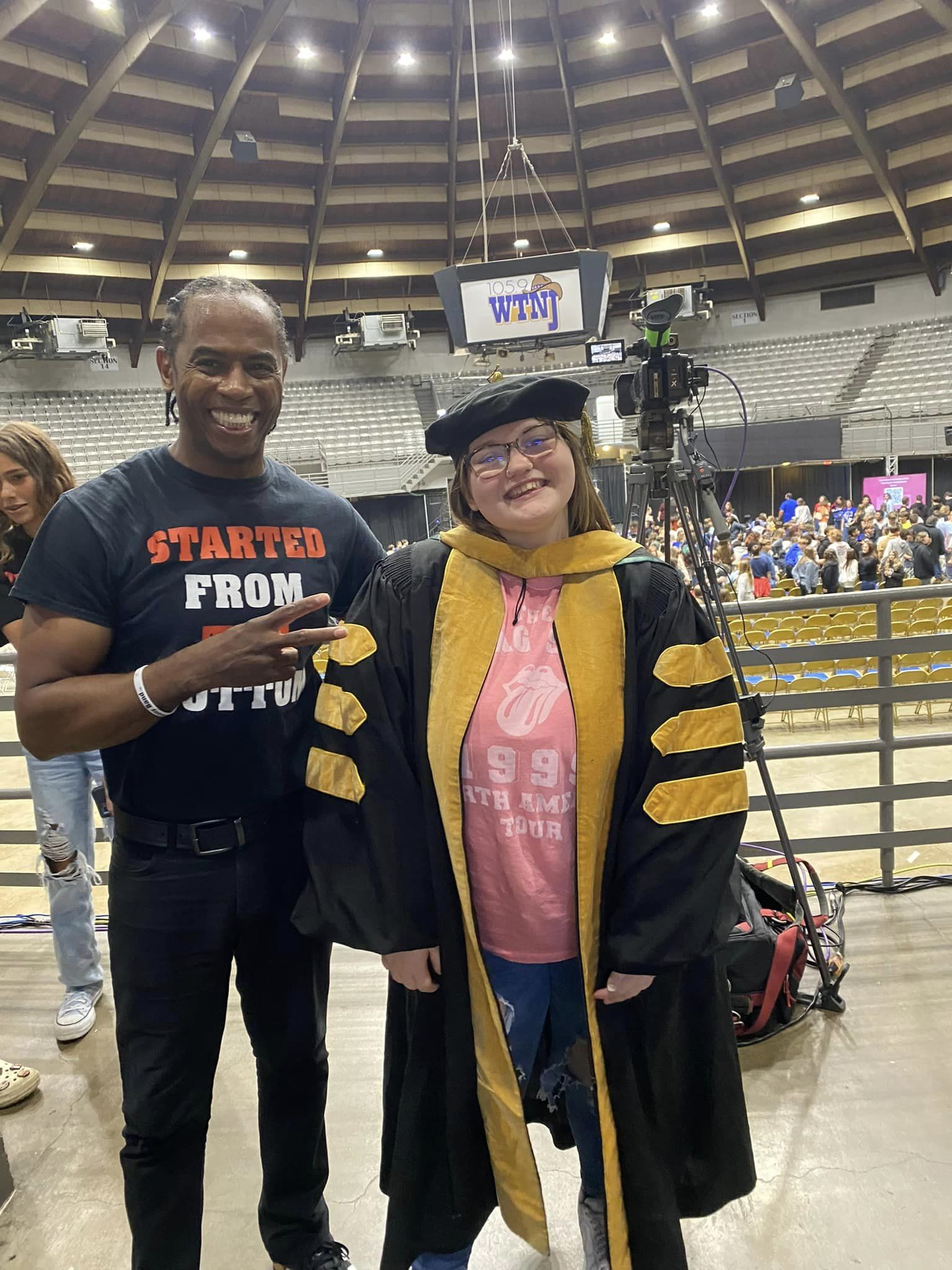 man smiling next to female student smiling