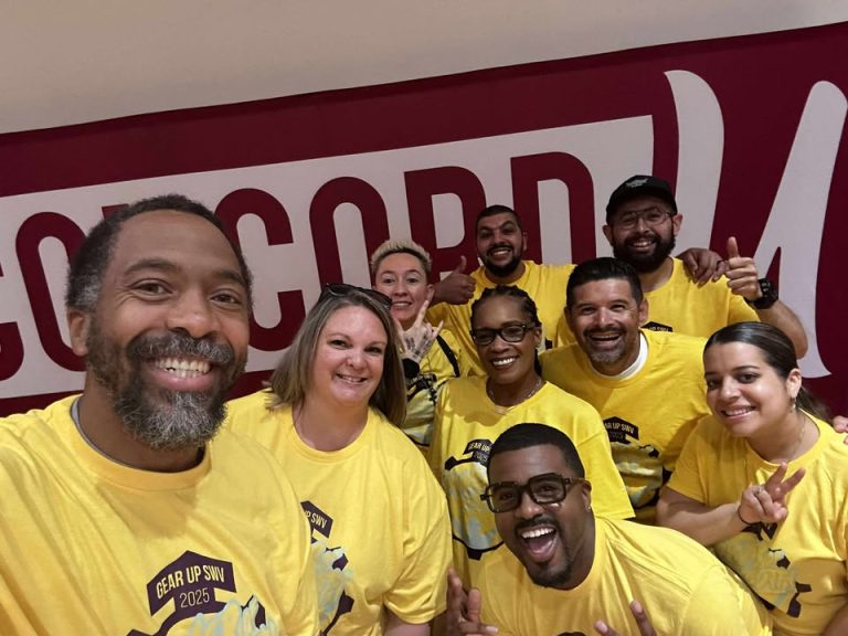 GEAR UP SWV Staff smiling in yellow tshirts in front of Concord U mural