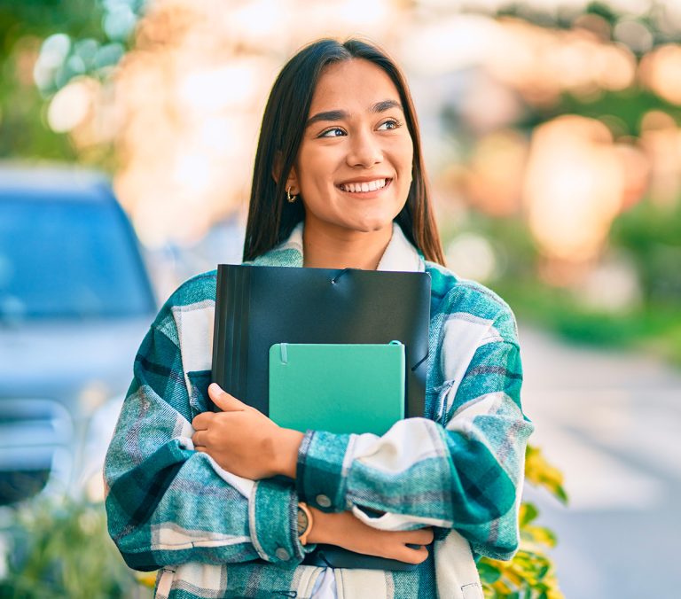Student in street smiling