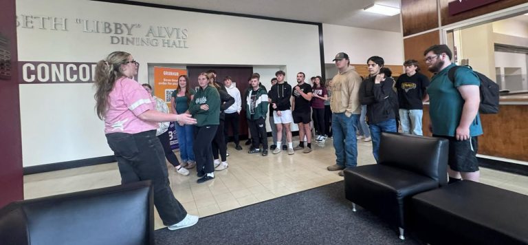 students listening to a speaker at Concord University beside chairs